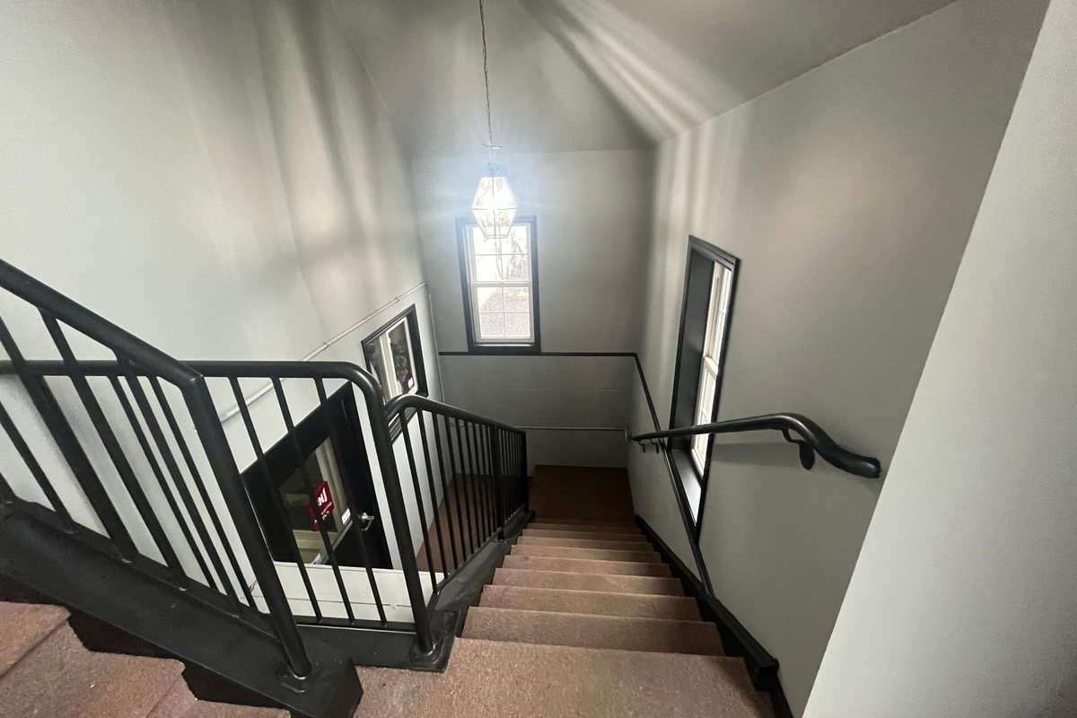 Open stairwell and landing after paint and new handrails by MDM Painting & Remodeling, Reading